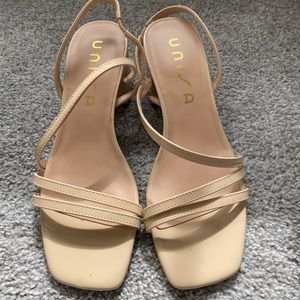 Cream colored heeled sandals. Only worn once.